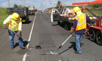 Asphalt repair crack sealing asphalt by G P Maintenance Solutions on Honolulu parking lot